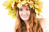 Beautiful fall woman. close up portrait of girl with  autumn wreath of maple leaves