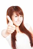 smiling young woman with thumbs up