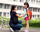 back to school.happy asian mother with daughter in school