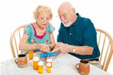 Senior Couple Sorts Medications