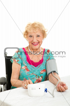 Woman Taking Her Own Blood Pressure