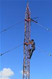 Radio Tower Worker Climbing on a Tower