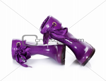 Purple rubber boots for kids isolated on white background