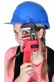Funny female laborer with wrench
