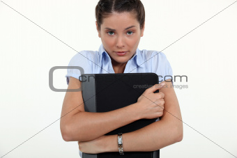 Worried woman clutching folder
