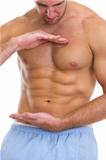 Closeup on male athlete showing great abdominal muscles