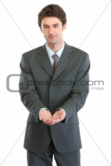 Businessman showing something on open palms