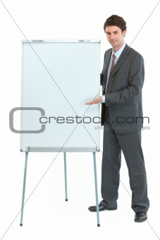 Full length portrait of businessman near flipchart stand