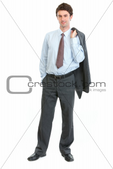 Full length portrait of happy businessman with jacket on shoulder