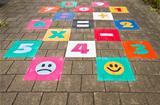 Streetgame for children on sidewalk