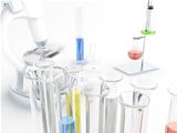 Microscope and glass test tubes in laboratory