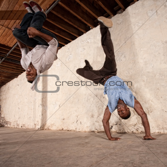 Capoeria Martial Artists Flipping