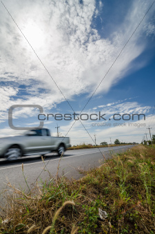 Road in rustic city and motion car