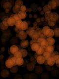 Abstract background of orange glittering lights