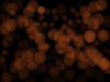 Abstract background of orange glittering lights