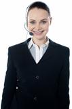 Woman wearing headsets, could be receptionist