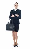 Full length of businesswoman with handbag