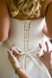 tying the wedding dress