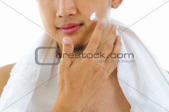 Man applying lotion