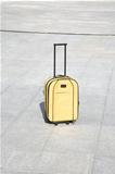 yellow suitcase alone