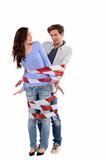 Couple being forcibly held together by caution tape