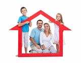 Young family with two kids holding house sign