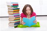 Young girl with lots of books