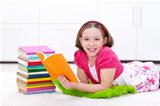 Happy young girl reading