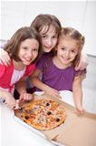 Three girlfriends sharing a pizza