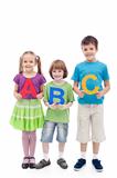 Happy school kids holding large abc letters