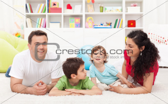Young family playing in the kids room