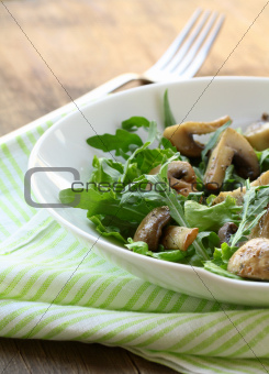 Fresh salad with arugula , grilled mushrooms