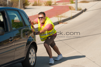 Pushing his car