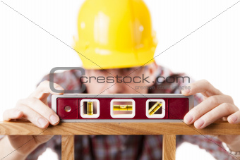 Worker using level