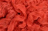 close up red knitted scarf background