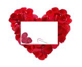 beautiful heart of red rose petals and greeting card with textil