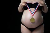 Pregnant woman expecting gold medalist.