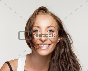  portrait of a young beautiful woman with brown hair smiling