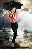 beautiful woman with umbrella, takes tatch with both hands