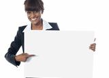 Corporate female executive pointing towards blank banner