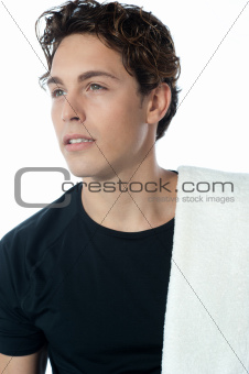 Young handsome guy with towel, closeup shot