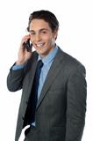 Portrait of a smiling businessman using a cellphone
