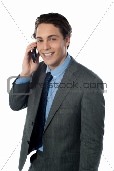 Portrait of a smiling businessman using a cellphone
