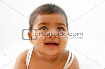 Indian baby girl looking up