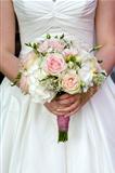bride holding a bouquet of wedding flowers