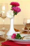 holiday table setting with flowers