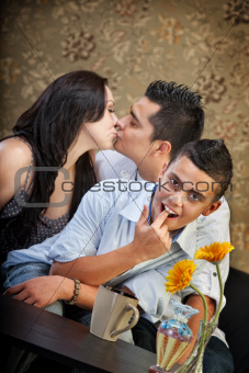 Boy Pretends to Gag While Parents Kiss
