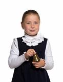 Young school girl ringing a golden bell on white background 