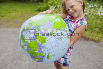 Girl holding an earth globe