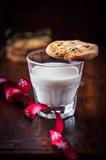 Butter cookie with pistachios on a glass of milk